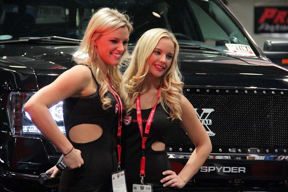 Models at Spyder pavilion at SEMA Show