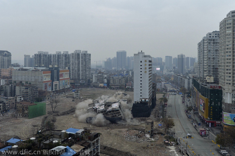 Wuhan brings down building with controlled blasting