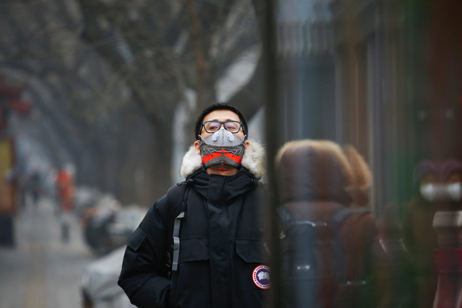 Beijing designer turns sneakers into smog masks