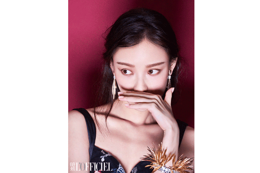 Actress Ni Ni poses for fashion magazine