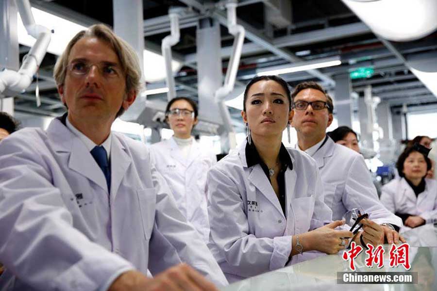 Gong Li visits L'oreal research center in Shanghai