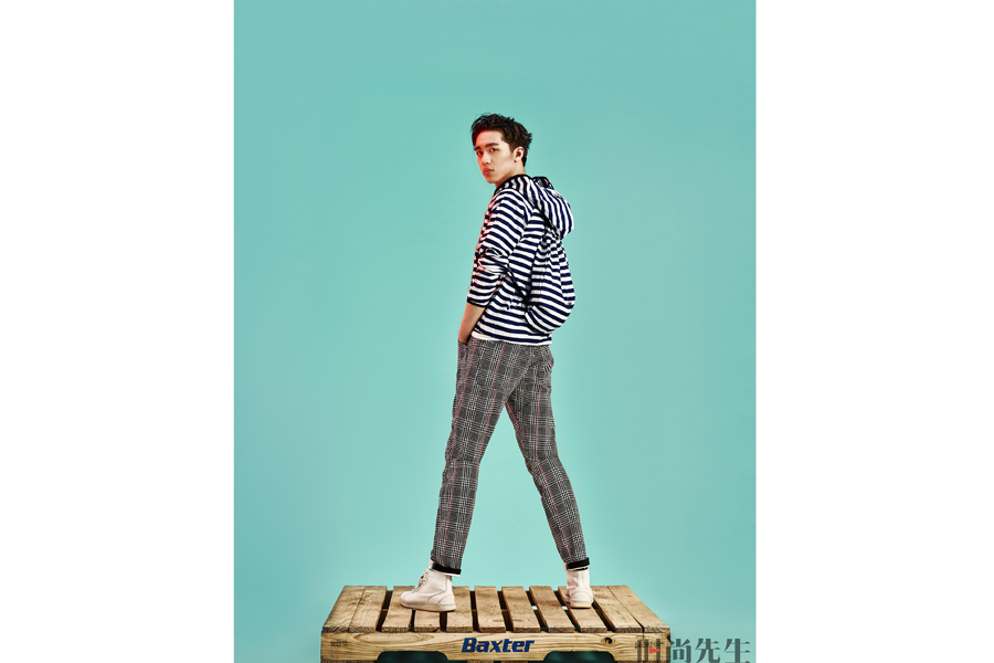 Actor Xu Weizhou poses for fashion magazine