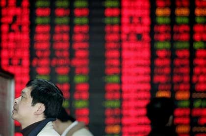 A Chinese investor looks at a stock prices board at a private security company Wednesday, Feb. 28, 2007 in Shanghai, China. Chinese stocks bounced back Wednesday following their worst plunge in a decade as regulators shifted into damage control, denying rumors of plans for a 20 percent capital gains tax on stock investments. The Shanghai Composite Index gained 3.9 percent to 2,881.07 after opening 1.3 percent lower. On Tuesday, it tumbled 8.8 percent, its largest decline since Feb. 18, 1997. (AP