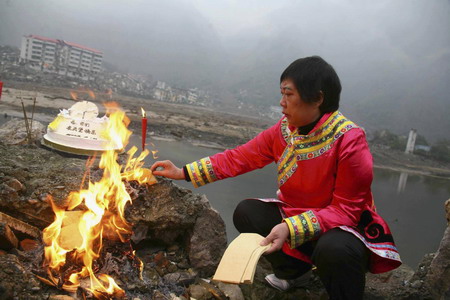 Women mourns passing relatives