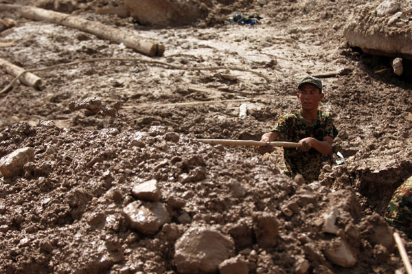 Aid, supplies pour into mudslide-flattened Zhouqu