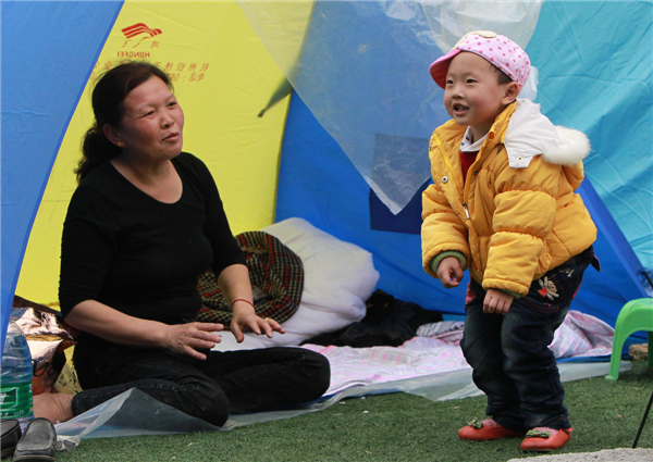 Child's smile soothes quake horror