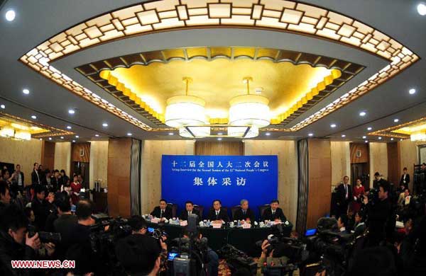 NPC deputies talk about industrial restructuring