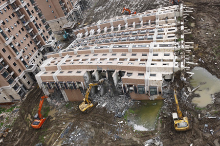 Demolition of collapsed building in Shanghai underway