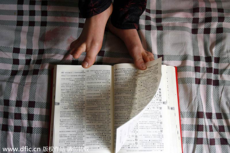 Woman uses her feet to run household