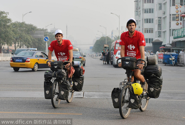 Duo ends pedal-powered journey from Paris to Beijing