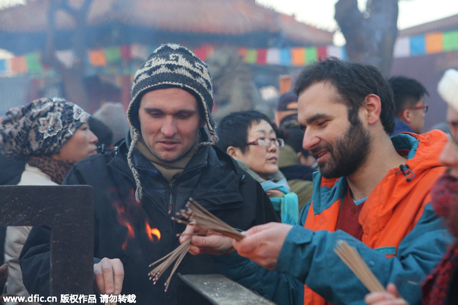 Chinese temples flooded with new year prayers, including foreigners