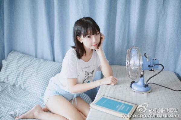 Chinese woman's use of Russian book as photo prop invites derision