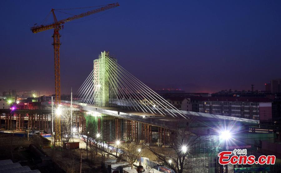 World's longest single axis bridge swings into place