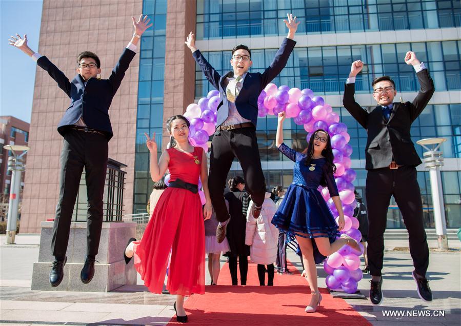 Students cheer at adult ceremony in North China