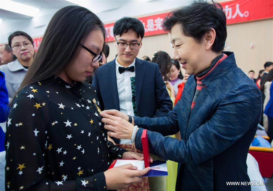 Students cheer at adult ceremony in North China