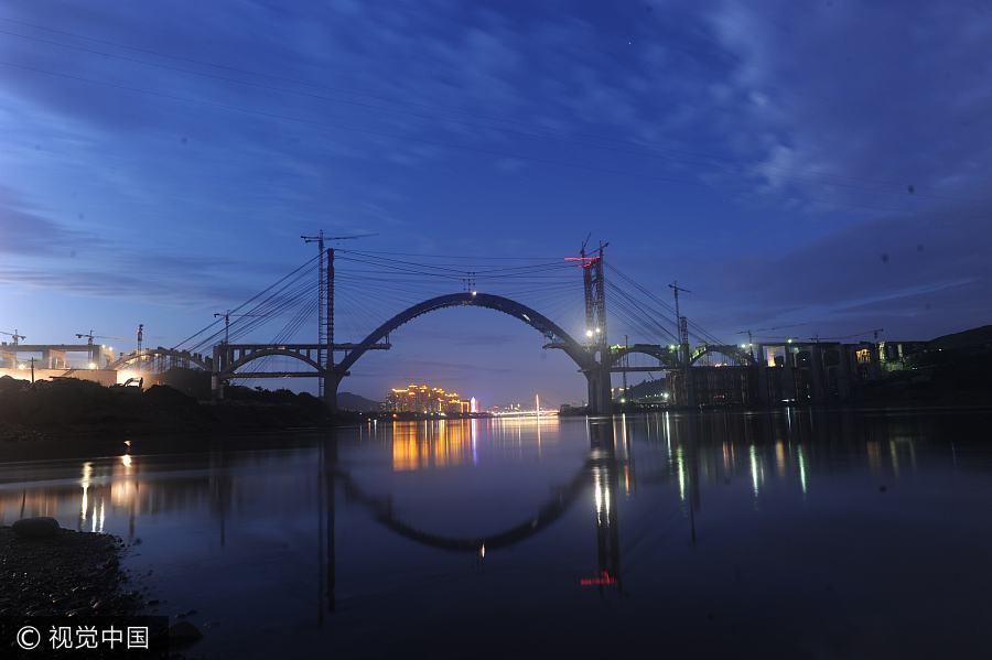 China inches closer to completing world's first 'rail above road bridge'