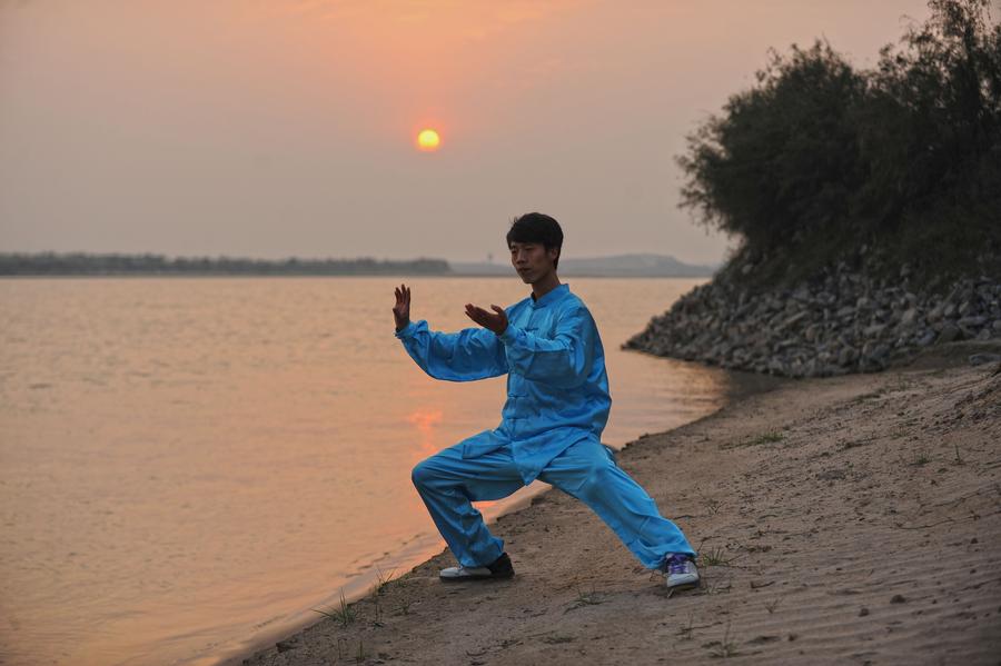 People practice tai chi in Henan