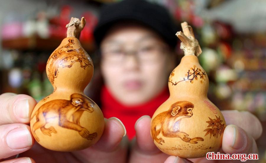 Monkeys on artist's gourd pyrography