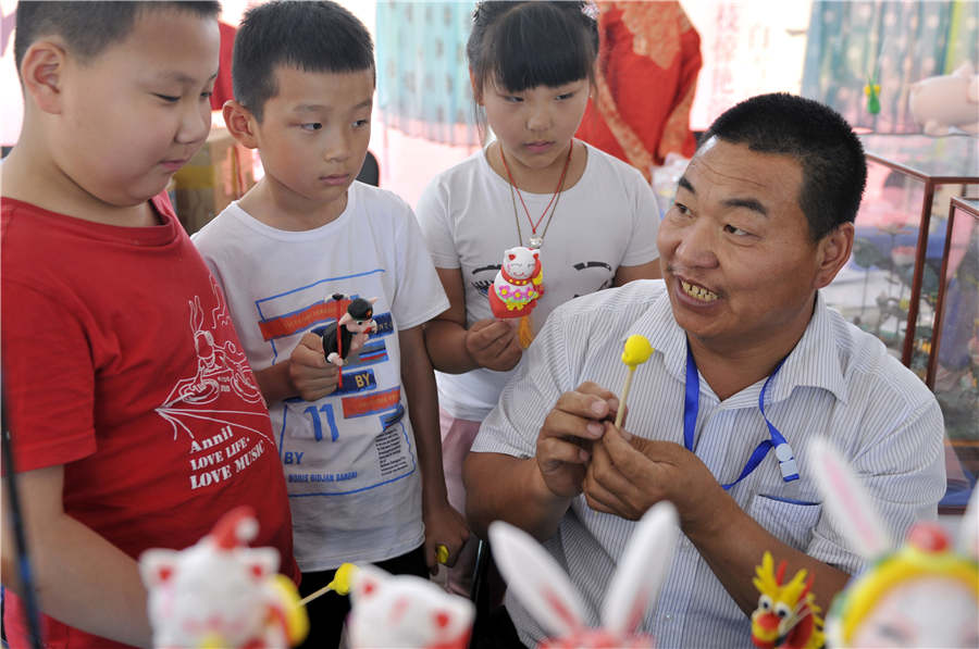 Dough figurines showcased at heritage expo in Shandong