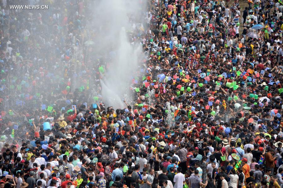 Water-sprinkling festival kicks off in SW China