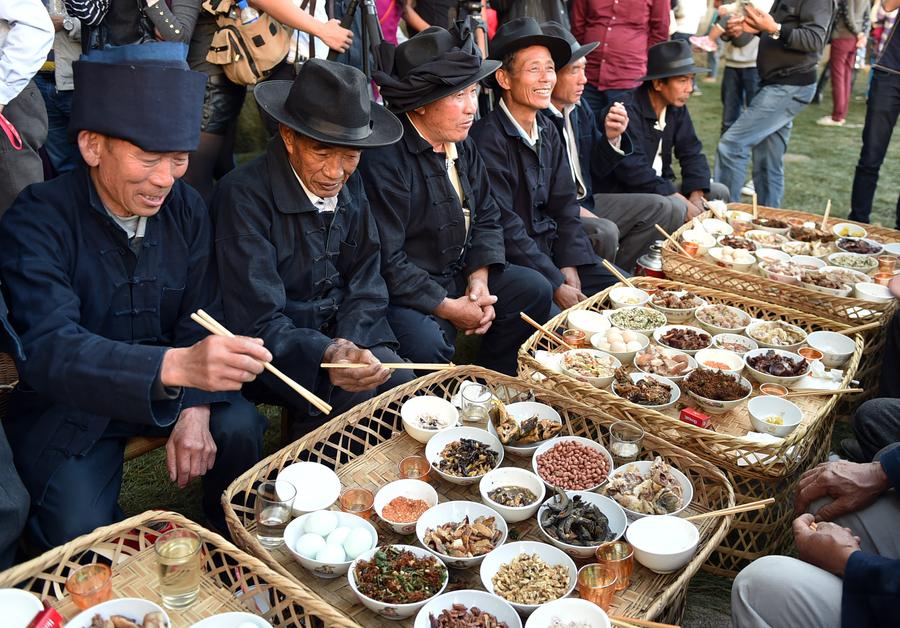 Locals enjoy themselves during traditional festival in Yunnan