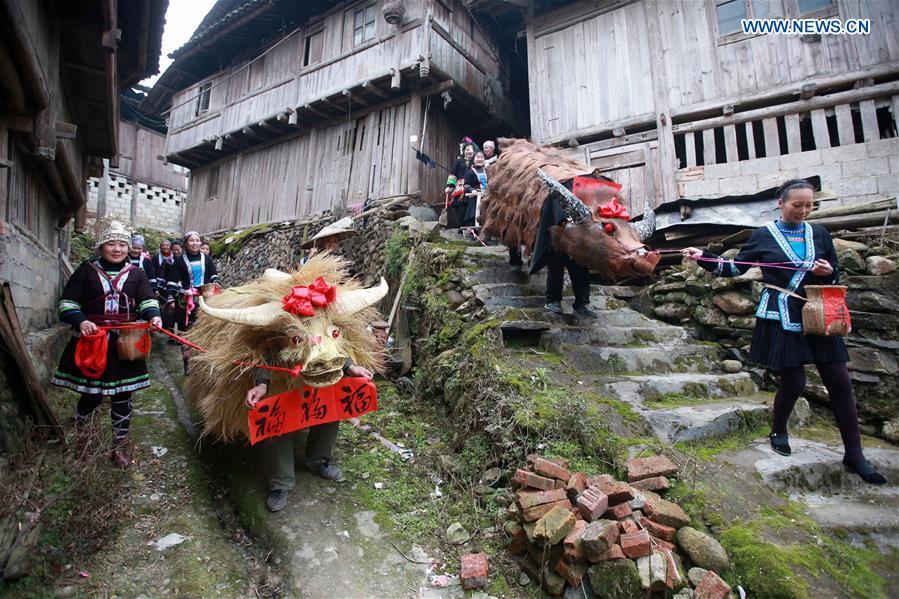 People take part in 'spring cattle' dance in S China