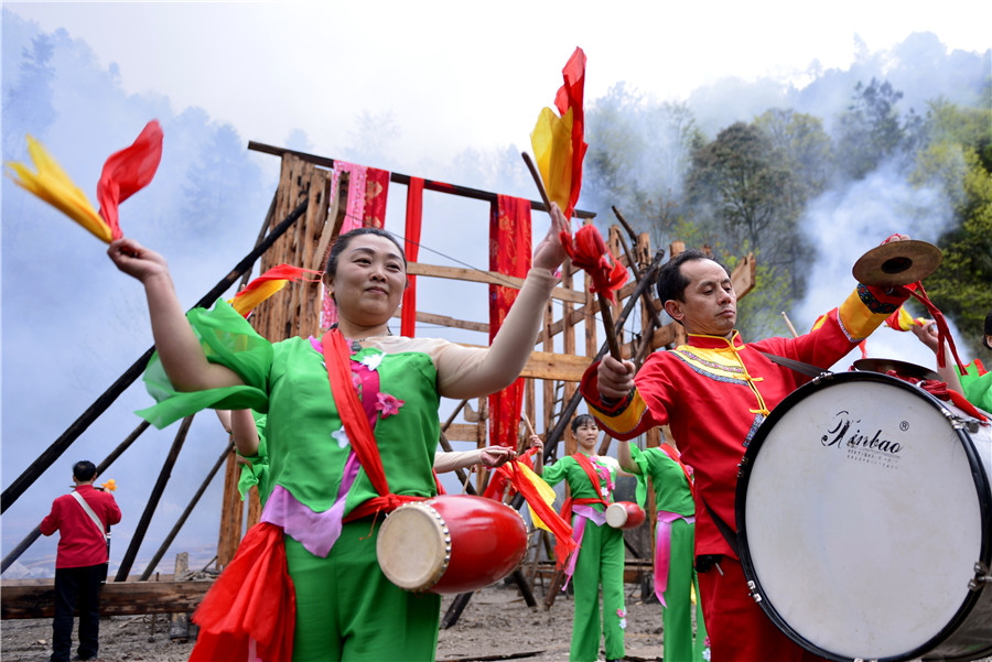 Ceremony held to start construction on a Tujia stilted house in C China