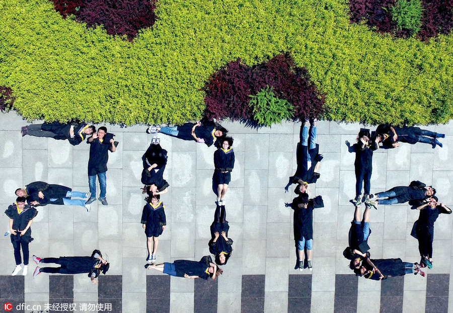 Students pose for special group photos to mark graduation