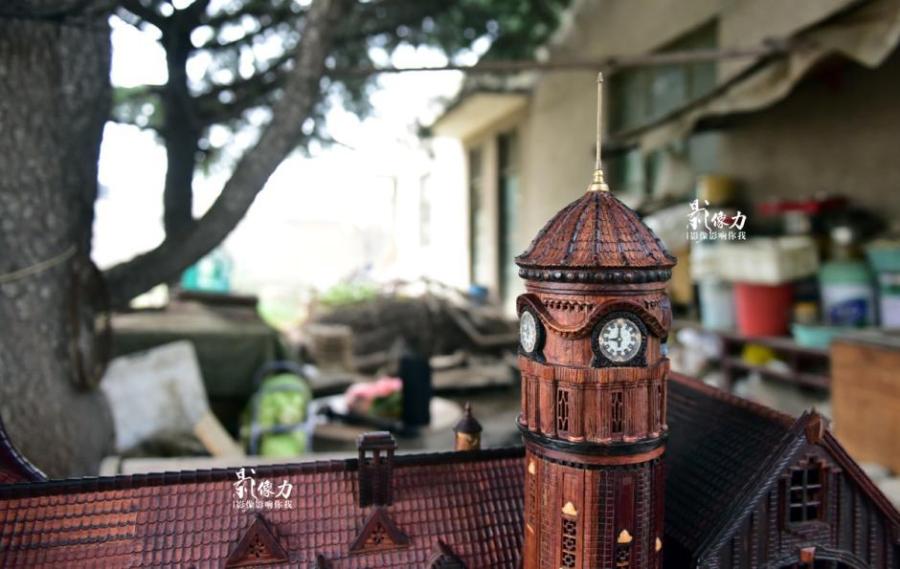 Retiree spends nearly three years carving iconic railway station