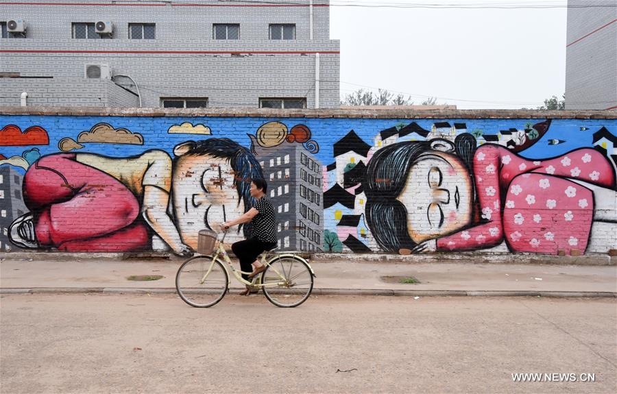 Qiannanbu village in N China covered with cultural graffiti works