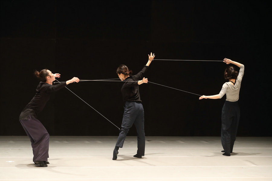 Modern dance performance represents human relationships