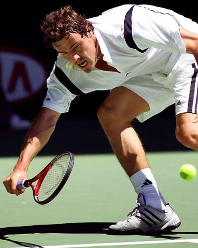 Fourth seed Russia's Marat Safin reaches for a forehand during his third round match against Croatia's Mario Ancic, the number 28 seed, at the Australian Open tennis championship in Melbourne January 21, 2005. Safin won the match 6-4 3-6 6-3 6-4. [Reuters]