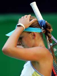 Slovakia's Daniela Hantuchova, the number 26 seed, reacts to a lost point during her third round match against Sixth seed Russia's Elena Dementieva at the Australian Open tennis tournament in Melbourne January 22, 2005. Dementieva won 7-5 5-7 6-4.