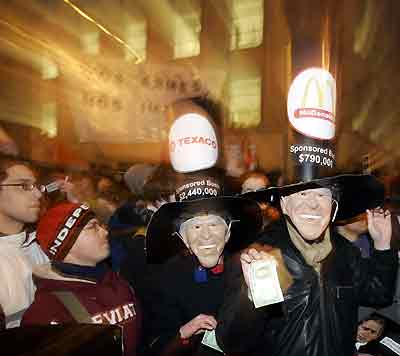 Protesters wearing masks of U.S. President George W. Bush pose during a demonstration against U.S. President George W. Bush in Brussels February 21, 2005. Bush is in Brussels to appeal to Europeans to replace disagreements over Iraq with what he called a new era of trans-Atlantic unity with a goal of spreading democracy across the Middle East. [Reuters]