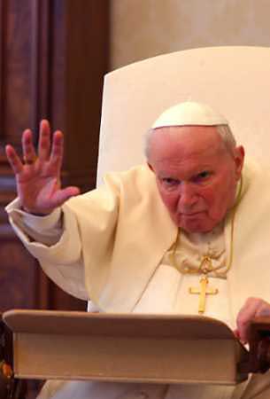 Pope John Paul II waves as he leads his weekly general audience from his private apartments at the Vatican February 23, 2005. The Pope has been taken to an operating room in Rome's Gemelli hospital and was expected to have surgery later Thursday to help him breathe more easily, Italian media said, quoting unnamed sources. [Reuters]