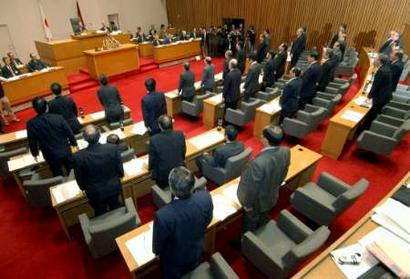 Shimane prefectural assembly members rise in Matsue, western Japan March 16, 2005 as they vote on the passage of a bill designating February 22 as 'Takeshima Day'. The Shimane assembly declared 'Takeshima Day' as a special day named for islands disputed with South Korea on Wednesday to stress Japan's claim over them, a move certain to fuel the territorial row and inflame Koreans. [Reuters]