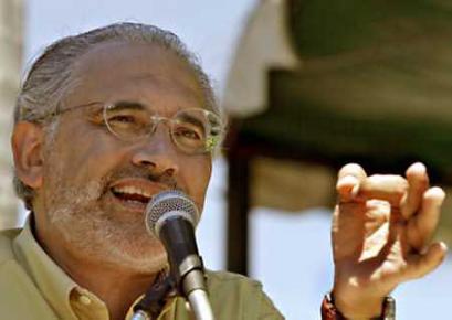 File photo of Bolivian President Carlos Mesa speaking at a ceremony in Puerto Suarez on the border with Brazil, on March 14, 2005. Mesa, besieged by street protests that have paralyzed the country, said he would ask Congress to call early elections in August to replace him. (Reuters - Handout) 