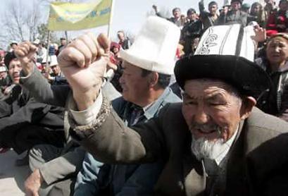 Opposition protesters rally in the southern Kyrgyz town of Jalal Abad, March 23, 2005. President Askar Akayev, under pressure from violent protests in the south of Kyrgyzstan over a disputed election, sacked his interior minister and the general prosecutor. (Viktor Korotayev/Reuters) 