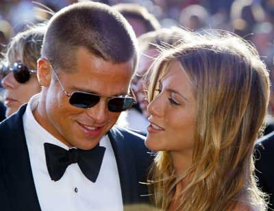 Brad Pitt and Jennifer Aniston arrive at the 56th annual Primetime Emmy Awards in Los Angeles in this September 19, 2004 file photo. Jennifer Aniston filed for divorce on March 25, 2005 from Brad Pitt, some two and a half months after Hollywood's golden couple announced they were separating, court papers in Los Angeles showed.