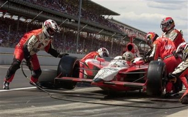 Dan Wheldon of Great Britain makes a pit stop on his way to winning the 89th running of the Indianapolis 500 at Indianapolis Motor Speedway on Sunday, May 29, 2005, in Indianapolis. (AP 