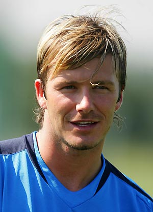 England soccer captain David Beckham smiles during training near London ahead of the World Cup qualifier against Wales, August 31, 2005. England are due to face Wales at the Millennium Stadium in Cardiff on September 3.