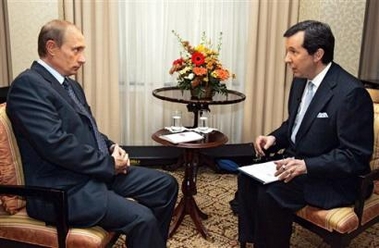 Russian President Vladimir Putin, left, speaks with Chris Wallace, host of 'FOX News Sunday with Chris Wallace', during an interview to Fox News in Washington, Saturday, Sept. 17, 2005.