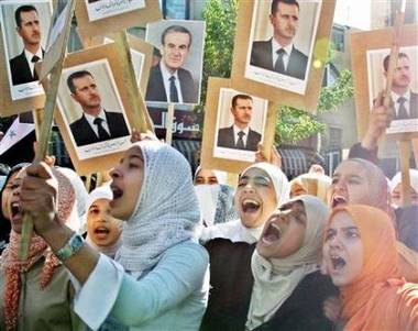 Syrians chant slogans during a protest in Damascus October 24, 2005. 