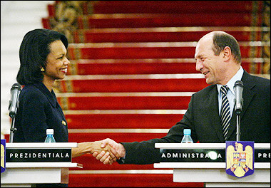 US Secretary of State Condoleezza Rice (L) shakes hands with Romanian President Traian Basescu (R) after the press conference minutes before the signing of the 'Access Accord' at Cotroceni Palace, the Romanian Presidency headquarters in Bucharest.