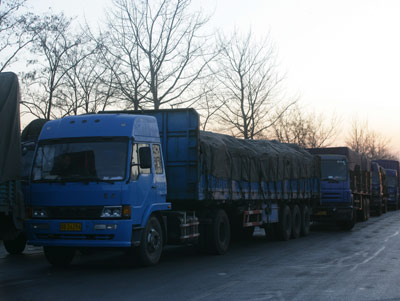 A world-record marathon runner could cover 30 kilometres in less than 2 hours but for many heavy trucks stuck in a massive Beijing suburb traffic jam, going the same distance this week turned into a three-day ordeal. 