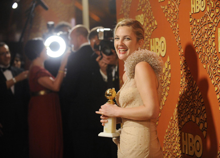 Drew Barrymore holds a Golden Globe for her work in 