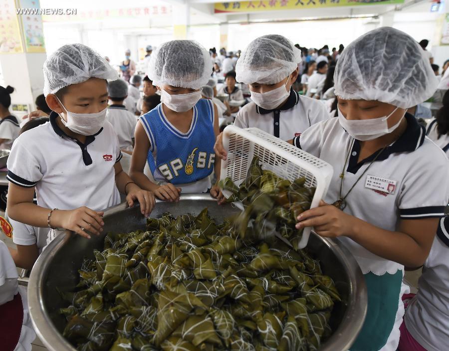 Chinese wrap up Zongzi to mark upcoming Dragon Boat Festival