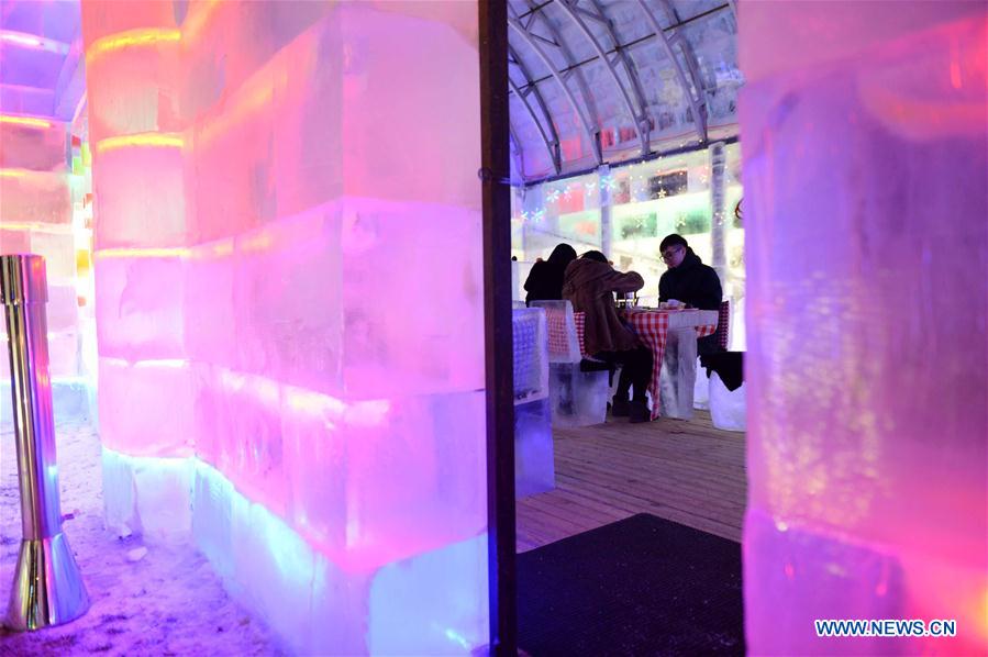 People enjoy meal in ice restaurant in NE China