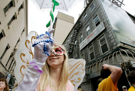 Janene Hodgkins of Orlando, Florida parades down Royal St. with the Krewe of Coleen Mardi Gras Day in New Orleans, Louisiana February 20, 2007.