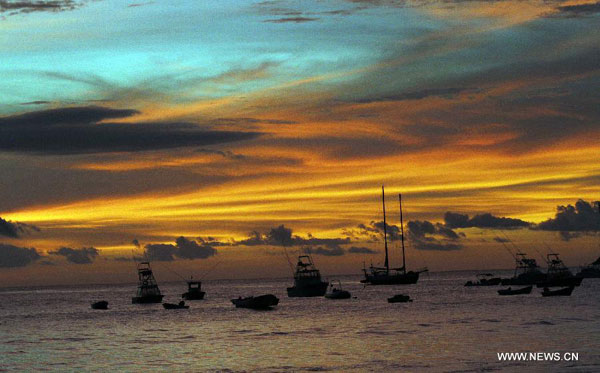 Tourists enjoy time on Tamarindo Beach in Costa Rica